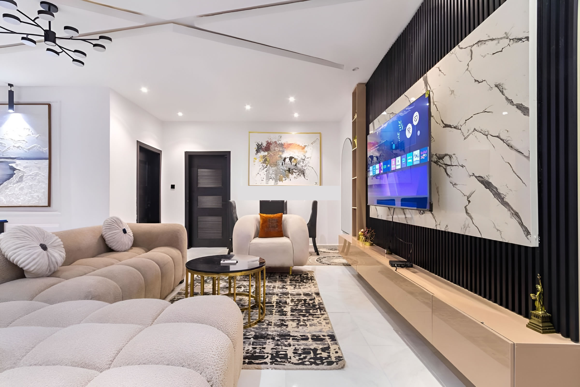 Designer living room with smart TV at The Sterling Suite